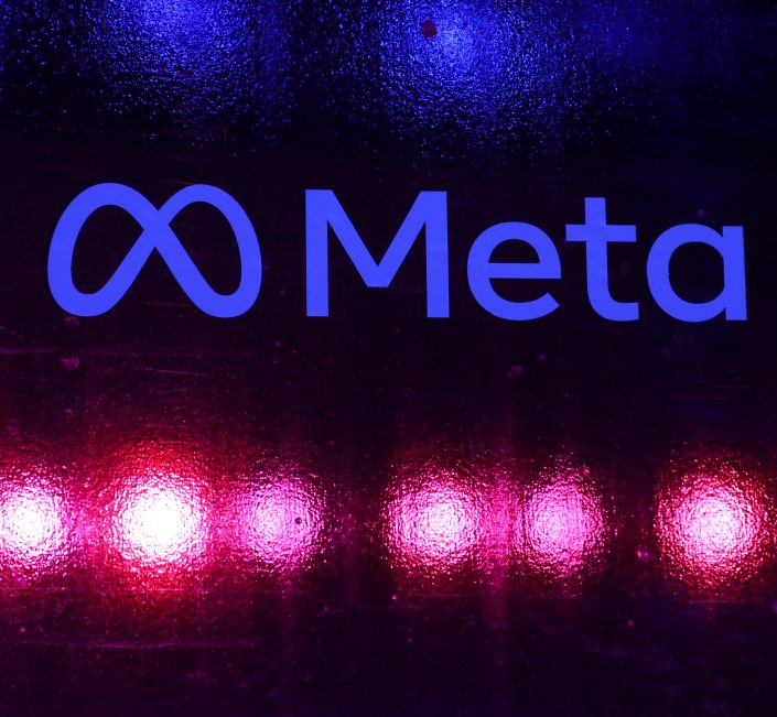 Logo von Meta und darunter punkte Neonstrahlen